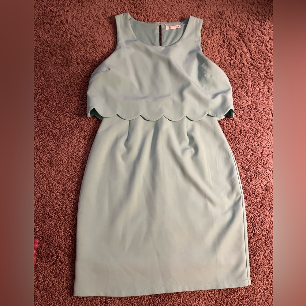 Stunning simple mint green dress with a scalloped detail!